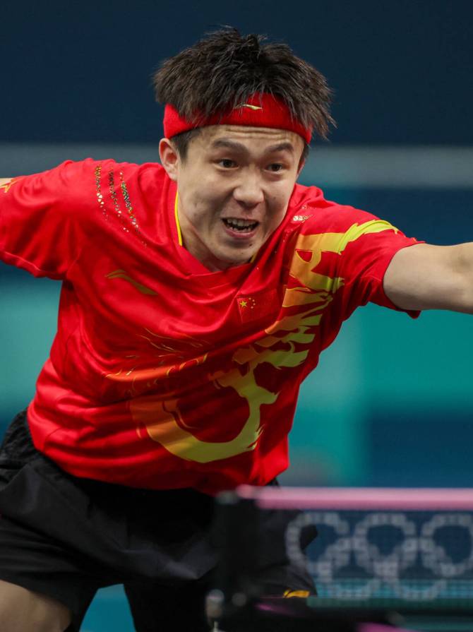 Paris 2024 Olympics - Table Tennis - Men's Singles Round of 32 - South Paris Arena 4, Paris, France - July 31, 2024. Chuqin Wang of China in action during his round of 32 match against Truls Moregard of Sweden. REUTERS/Isabel Infantes